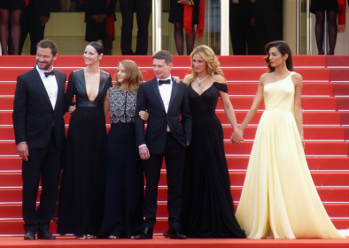 a group of actors posing for a photograph in cannes