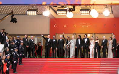 a group of actors posing for a photograph in cannes