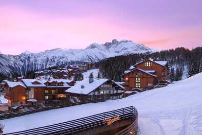 View of Courchevel's cosy chalets in the snow