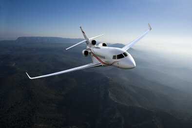 Falcon 7X in flight over idyllic landscape Falcon 7X in flight over idyllic landscape