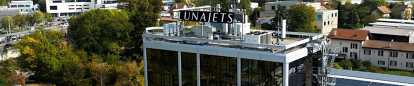 LunaJets headquarters with the sign of the company's logo on the roof by daylight