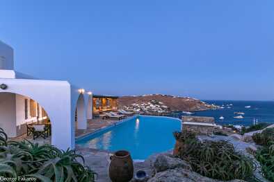 Night view from rockview villa with pool and view of the sea and beach