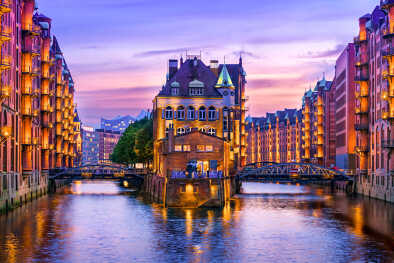 The warehouse district (Speicherstadt) in Hamburg, Germany, at dusk. View of Wandrahmsfleet. The world's largest warehouse district is located in the port of Hamburg in the HafenCity area.