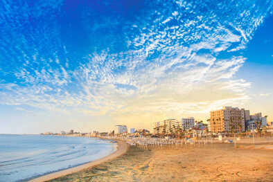 Beautiful view of the main street of Larnaca and Phinikoudes beach in Cyprus
