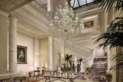 Big hall with cristal lamp in the entry of Palazzo Parigi Hotel Big hall with cristal lamp in the entry of Palazzo Parigi Hotel