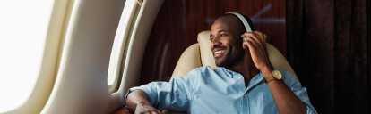 Man on a private jet listening to music