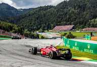 Four racing cars coloured in red and yellow at the Austrian Grand Prix Spielberg