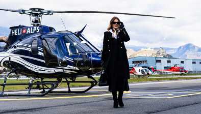 A classy lady leaving the helicopter at the airport of Sion, Verbier.