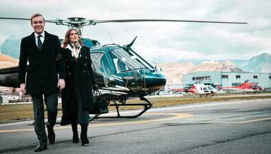 A classy couple leaving the helicopter at the airport of Sion, Verbier.