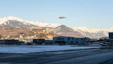 An aircraft landing at the airport of Sion, Verbier.