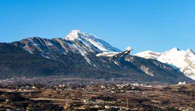 An aircraft landing at the airport of Sion, Verbier.