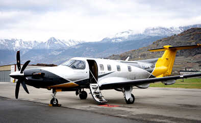Pilatus PC12 surrounded by alpine peaks, Sion airport, challenging airport Pilatus PC12 surrounded by alpine peaks, Sion airport, challenging airport