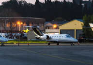 Panoramic view at night on private business planes, on a parking space Panoramic view at night on private business planes, on a parking space